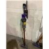 Image 1 : DYSON STICK VAC WITH ACCESSORIES AND CHARGER MODEL #ZJ1-CA-KMA2804A (TESTED WORKING)