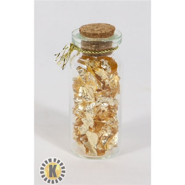 GLASS BOTTLE FILLED WITH GOLD FOIL