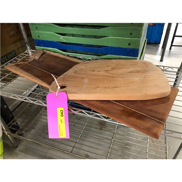 Two wooden bakers breadboards