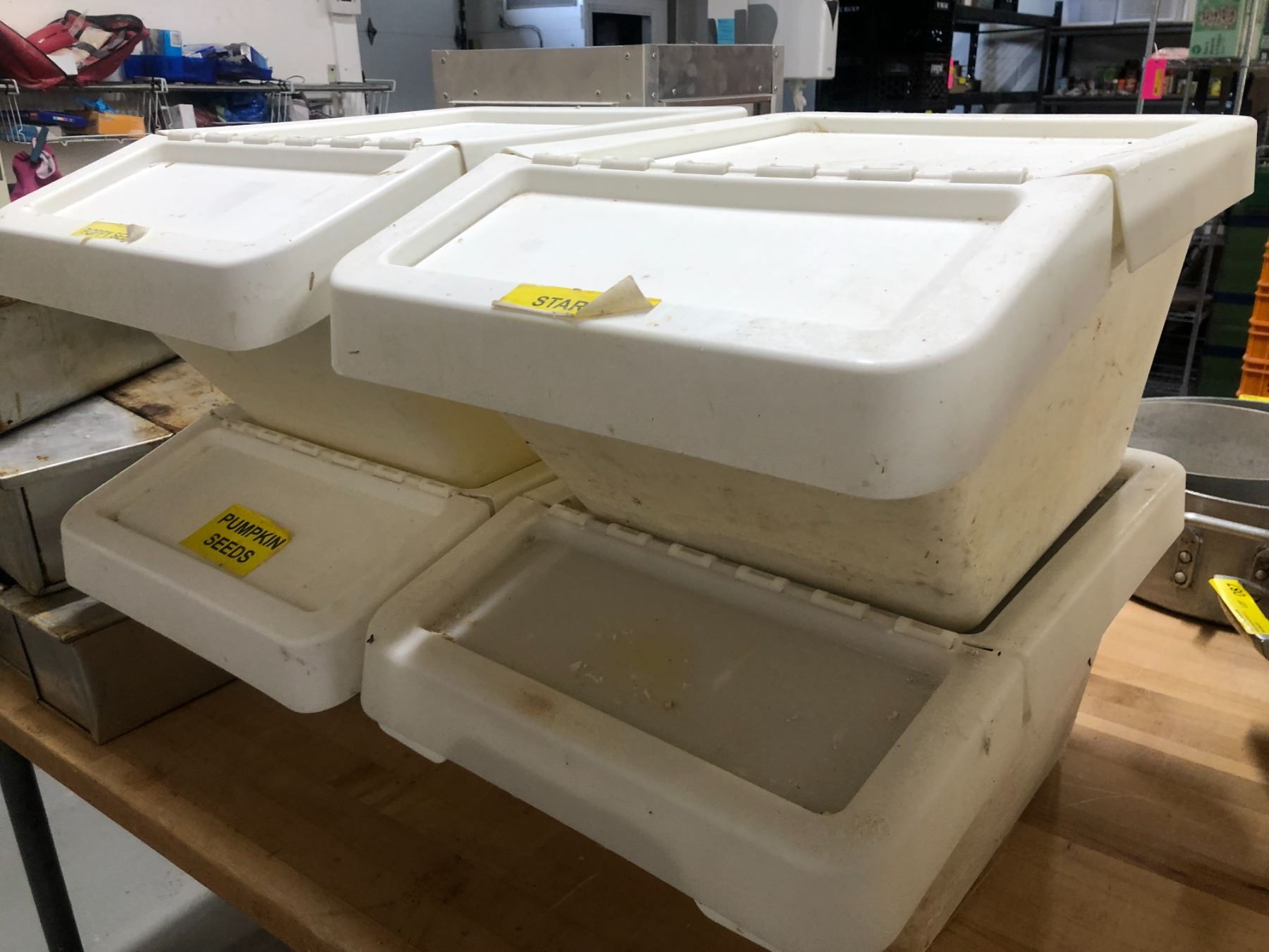 Group of 4 white plastic stackable dry ingredient storage bins