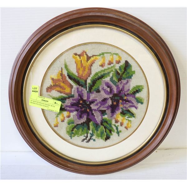 14  ROUND WOOD FRAME WITH CROSS STICHED DESIGN