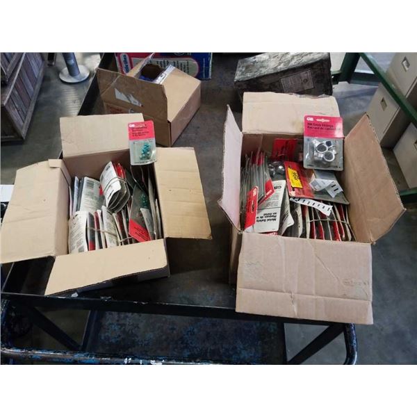 2 BOXES OF NEW GROUNDING SCREWS, CABLE FITTINGS, NAIL STRAPS AND MORE