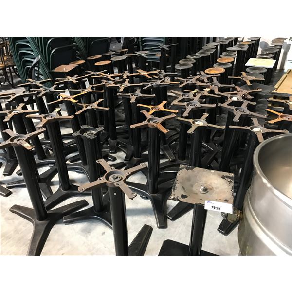 LOT OF APPROX. 50 BLACK METAL TABLE BASES AND APPROX. 20 GREY 2X2' BISTRO TABLE TOPS