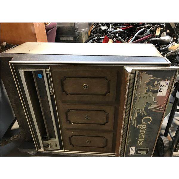 HOWE RIVIERA 25 VINTAGE CIGARETTE MACHINE WITH BROKEN LEG