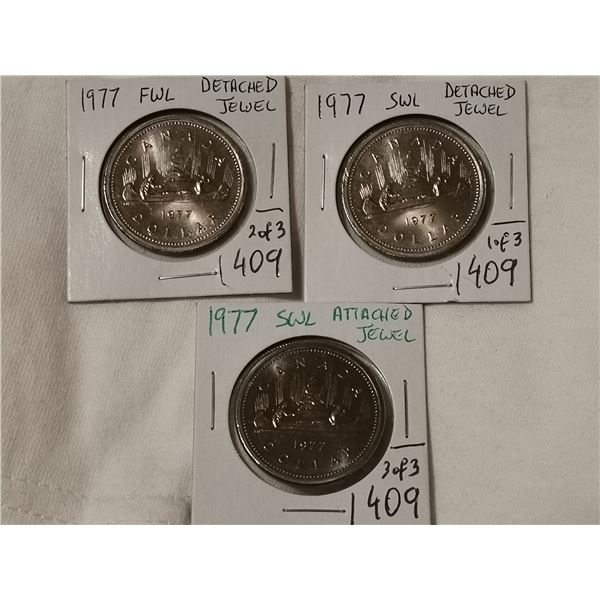 3 different 1977 dollar coins