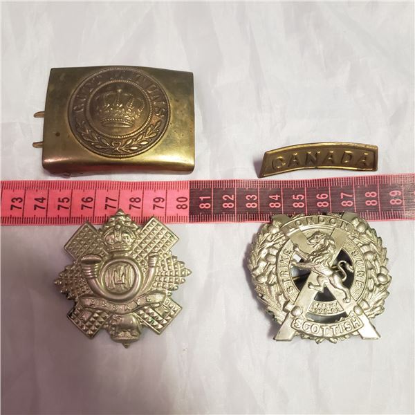 four Militaria military / RCMP / her Majasty  style badges medals