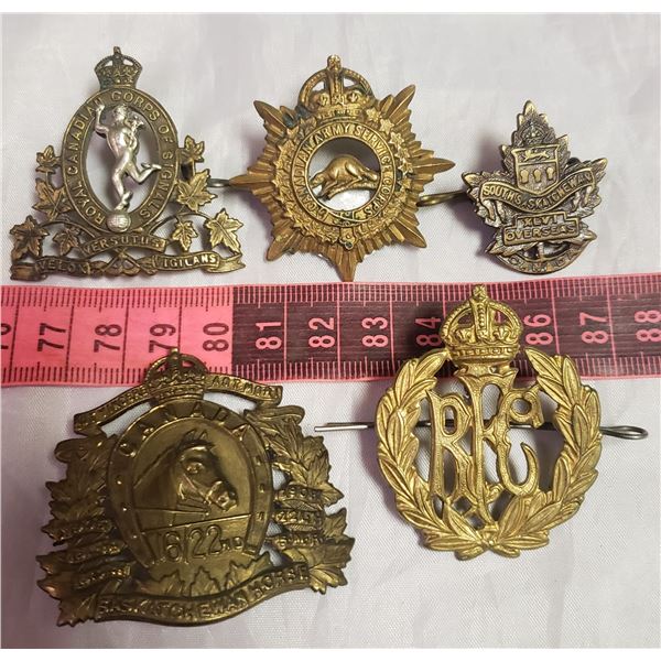 five Militaria military / RCMP / her Majasty  style badges medals