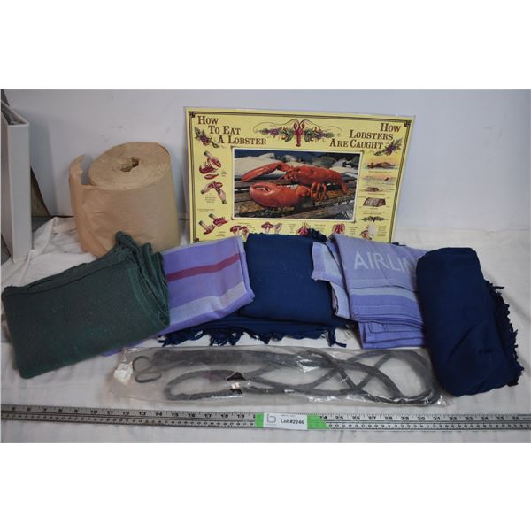 Wire basket of blankets + cattle whip + PEI 'how to eat a lobster' placemat