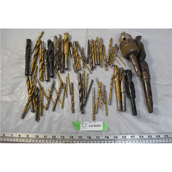 Box of oversized and small drill bits