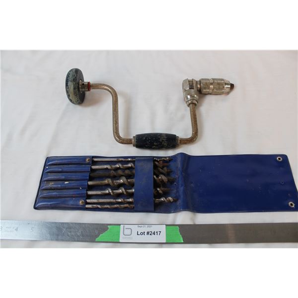 Vintage hand crank drill with drill bits