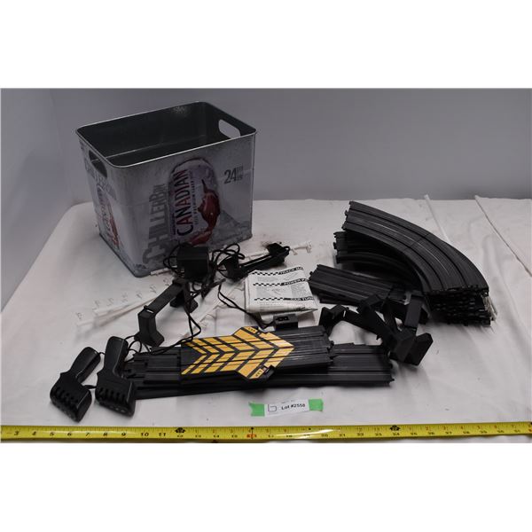 Slot car track with no cars. In Molson Canadian bucket