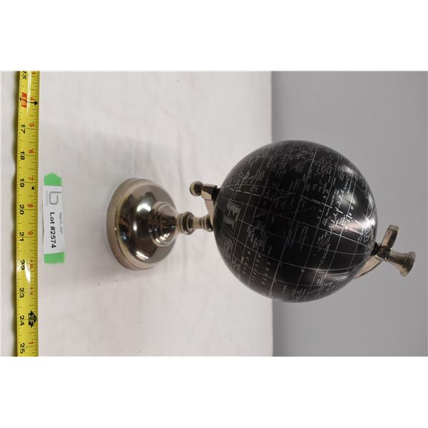 Small black and silver rotating globe