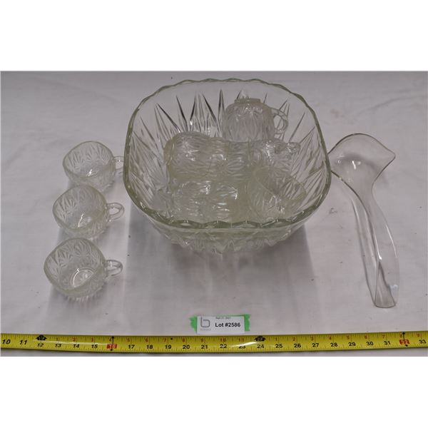 Punch bowl filled with glass cups