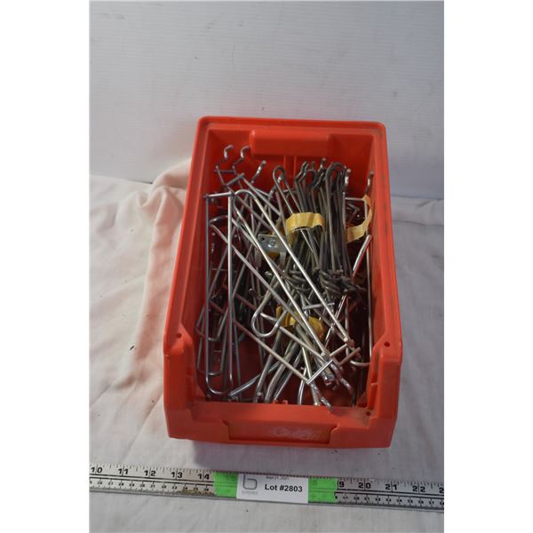 Storage container with shelf peg-hooks