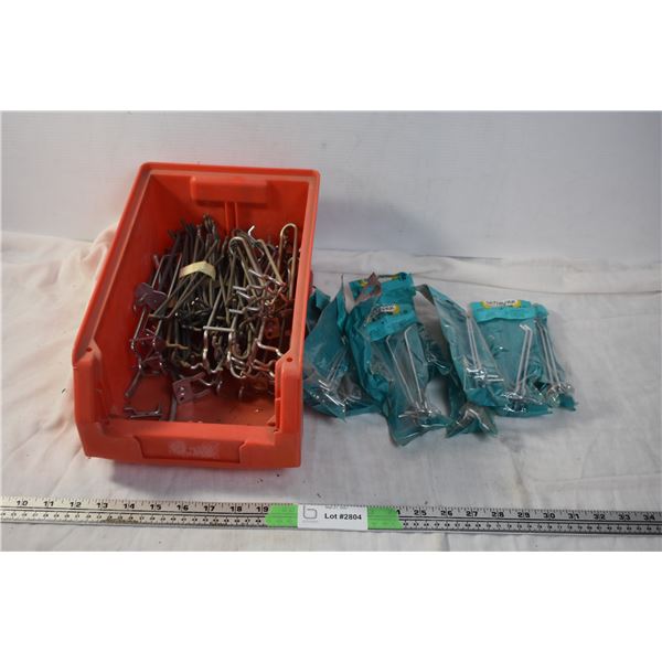 Storage container with shelf peg-hooks