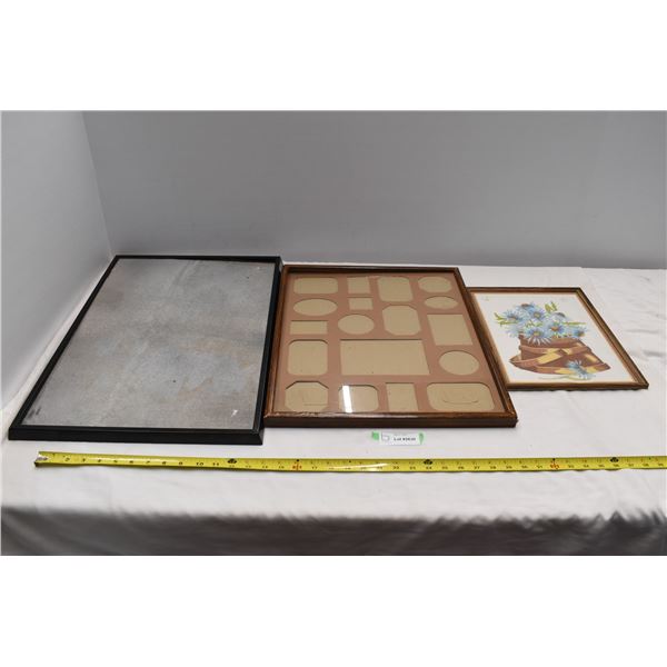 3 picture frames with 1 drawing.