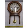 Image 1 : Wall hanging Rensie clock. Swinging pendulum