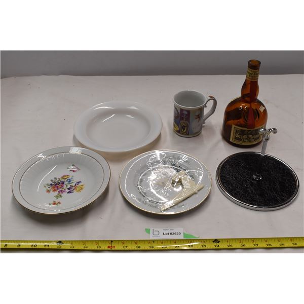 Empty Grand Marnier bottle, misc plates, Avon mug.