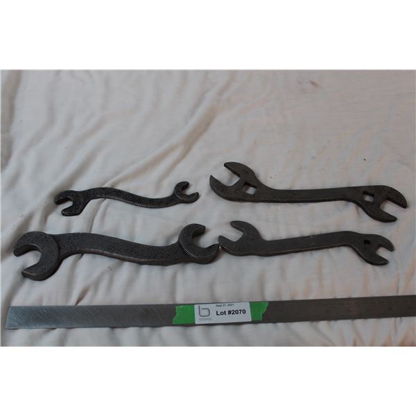 4 Curved antique wrenches