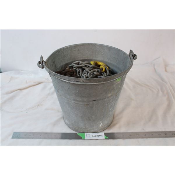 Galvanized bucket filled with heavy chain