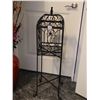 Image 1 : Ornate metal plant stand with removable top and legs.