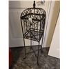 Image 3 : Ornate metal plant stand with removable top and legs.