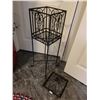 Image 4 : Ornate metal plant stand with removable top and legs.