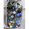 Image 2 : Assorted large and small fancy marbles in a mason jar.