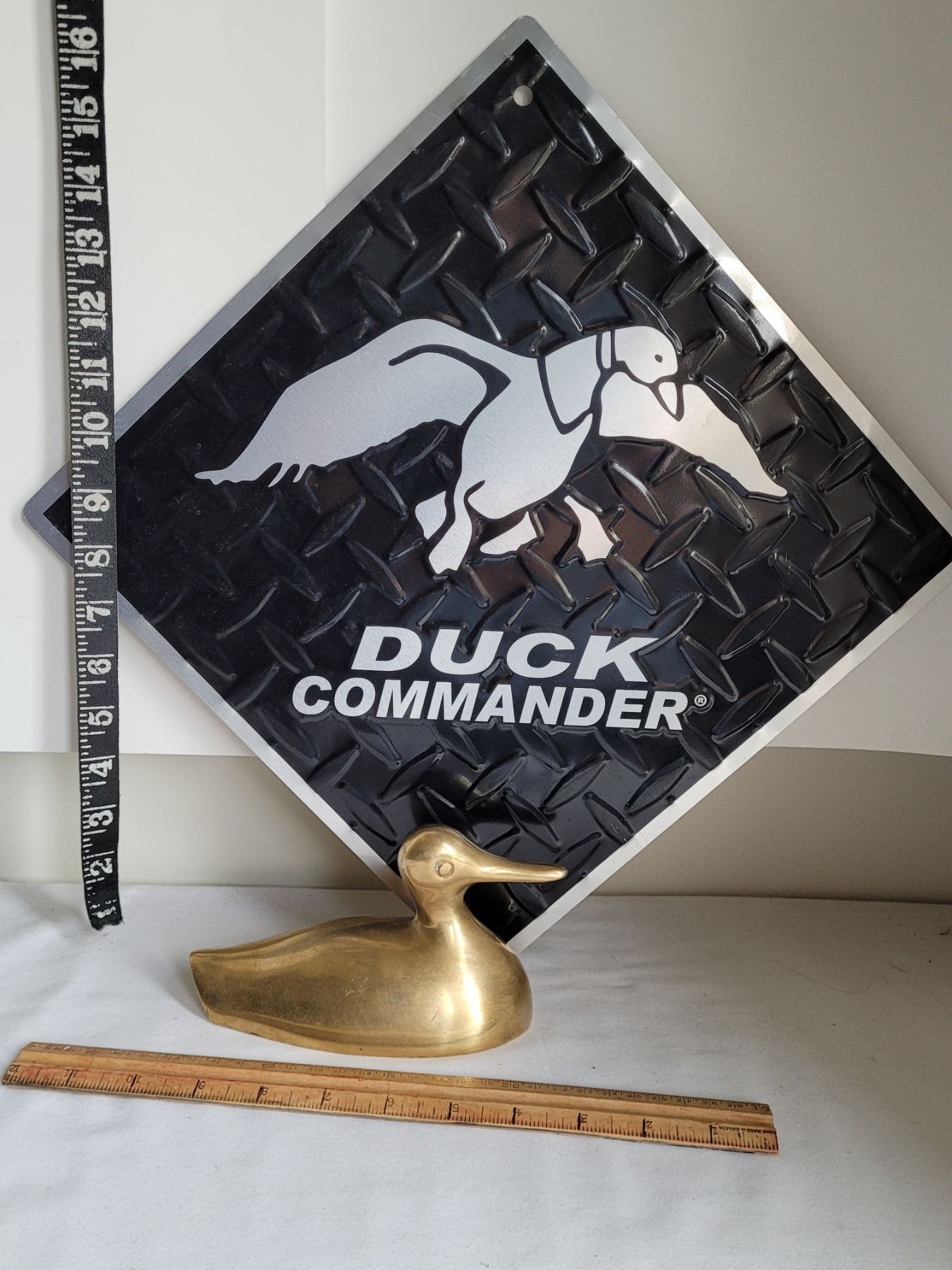 Brass Duck & duck commander tin sign. - Schmalz Auctions