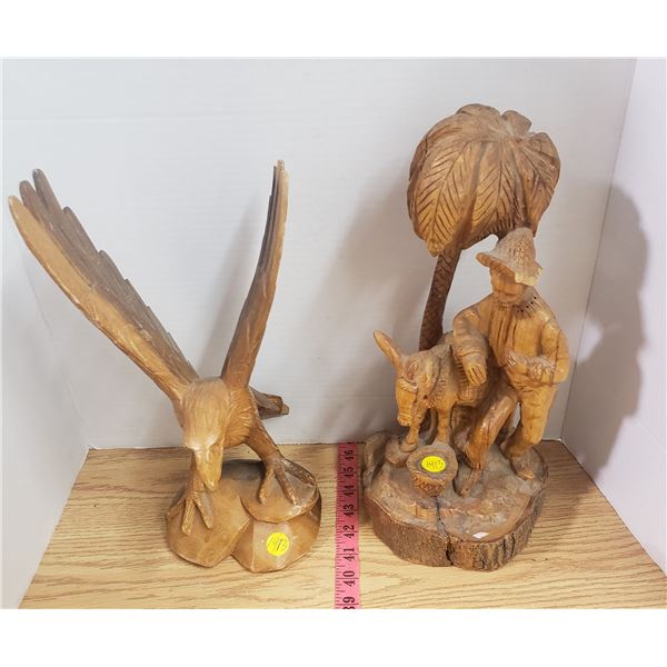 two wood carvings Eagle, Man with steed both have a little damage