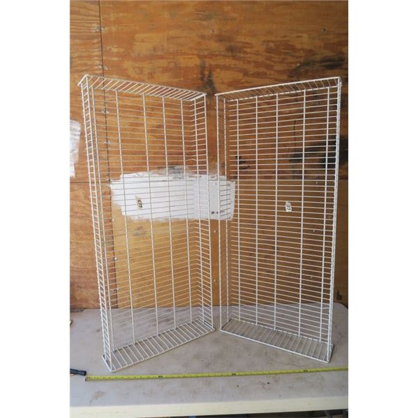 2 White Plastic Coated Wire Racks And One Smaller