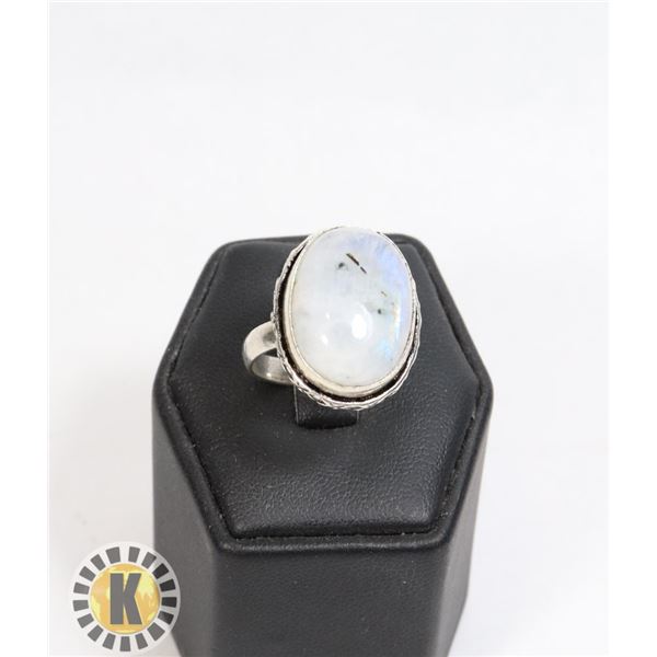 14)  OVAL NATURAL MOONSTONE RING, SET IN