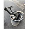 Image 1 : Garbage can and hoses