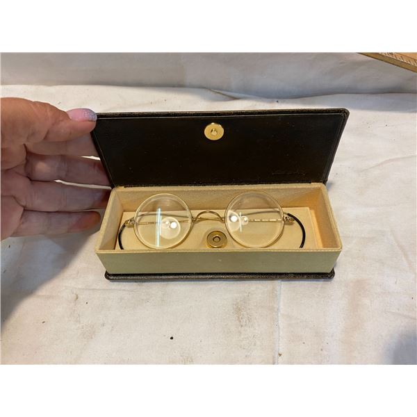 Antique eyeglasses in retro style vase