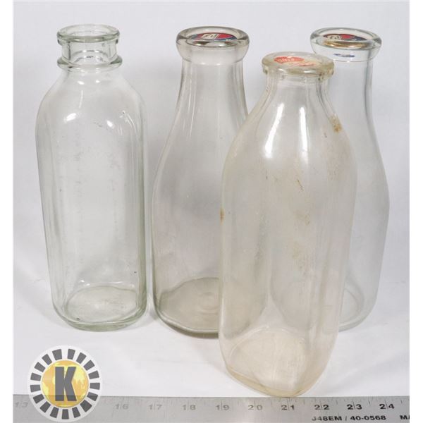 FOUR MILK BOTTLES