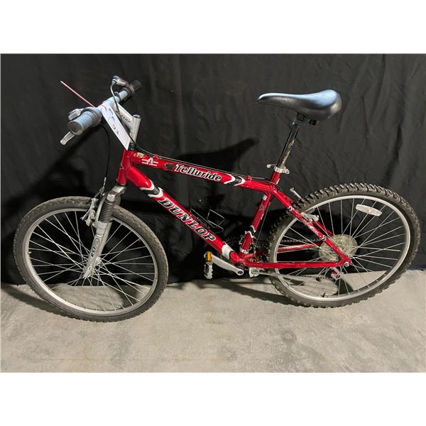 RED DUNLOP TELLURIDE, 21 SPEED FRONT SUSPENSION MOUNTAIN BIKE
