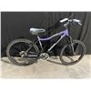 Image 2 : PURPLE REEBOK EMPRESS, 21 SPEED FRONT SUSPENSION MOUNTAIN BIKE