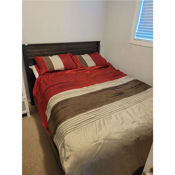 Queen size bed including mattress and bedding.