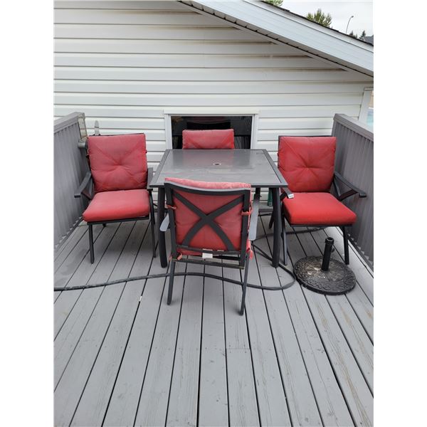 Glasstop Patio Set. 4 Chairs and Umbrella Stand