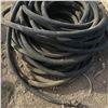 Image 2 : large coil of high pressure water hose w/ chicago couplers