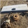 Image 1 : misc parts lot includes Chevrolet tailgate, transmission, brake drum