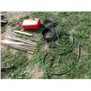 Image 1 : Gas Can, saw blade, hose, extension cord, magnet