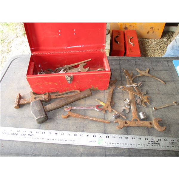 Metal tool box with vintage wrenches