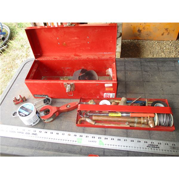 Metal tool box with soldering related tools