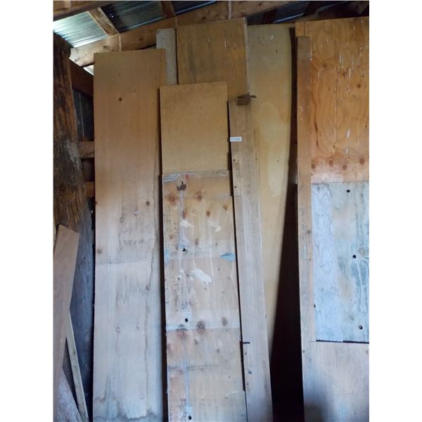 assorted lumber pieces and plywood