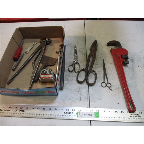 pipe wrench, snips, plus hand tools