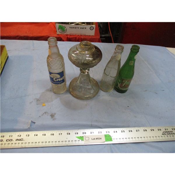 vintage pop bottles, bottom part of a glass lamp