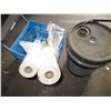 Image 2 : 2 partial rolls of plastic, with hydraulic fluid pail (1/2 full?)