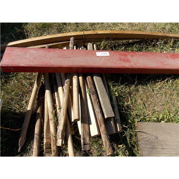 Assorted vintage wooden wheel spindles and parts