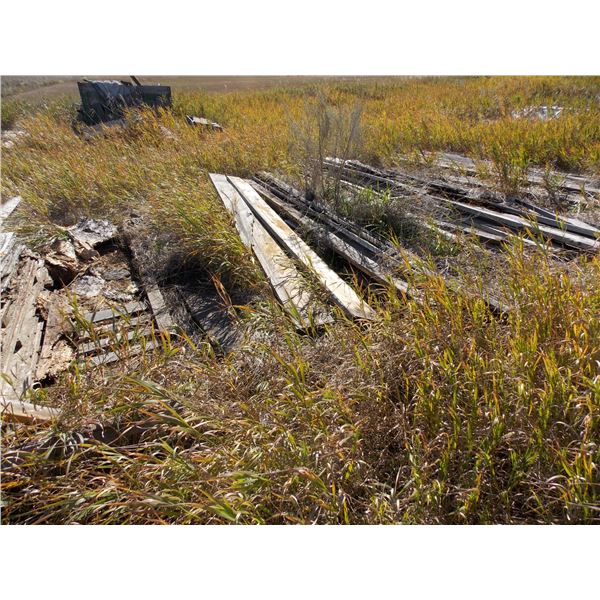Assorted piles of misc boards + lumber